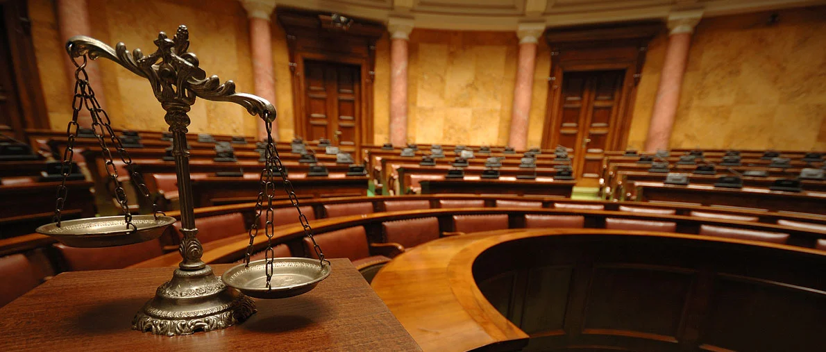 Scales of Justice in courtroom