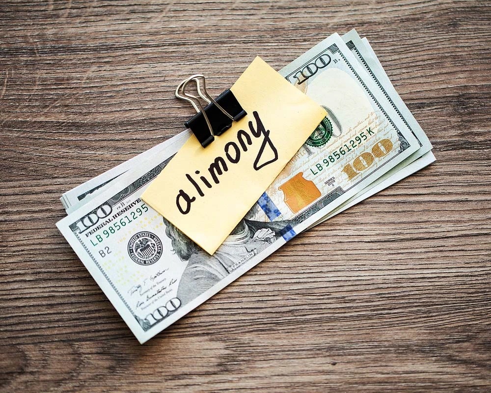 Alimony note clipped to cash