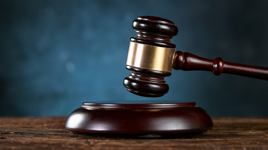 Gavel being struck to decide an auction or guilty verdict in cou